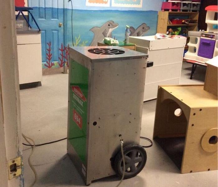 SERVPRO dehumidifier in a room in a childcare