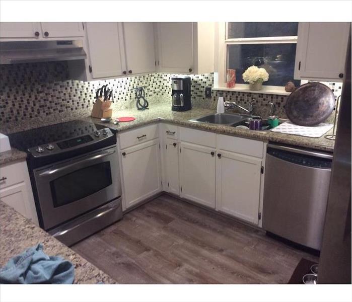 Kitchen with SERVPRO drying equipment running