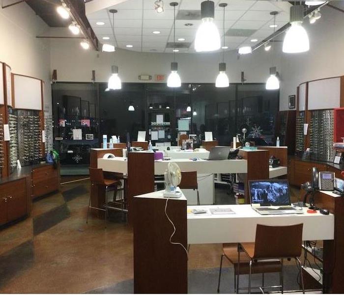 Optometry office with eyeglasses displays and work desks