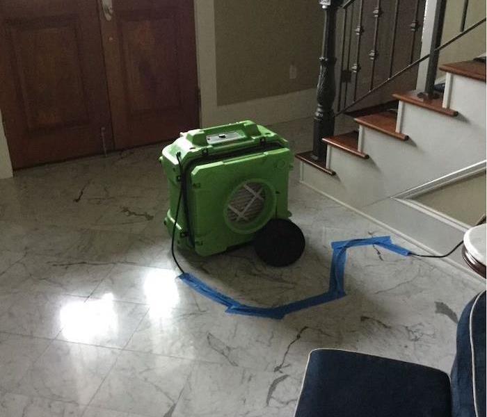 SERVPRO equipment on tile floor by stairwell