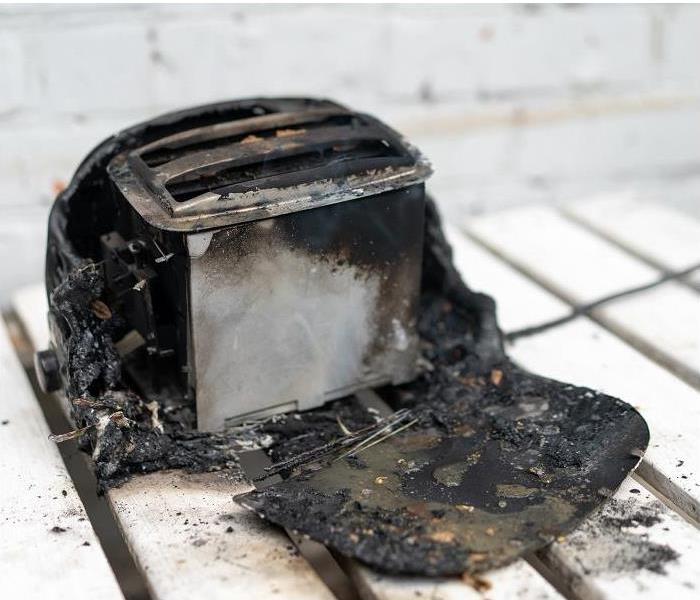 burnt toaster; charring and melted plastic