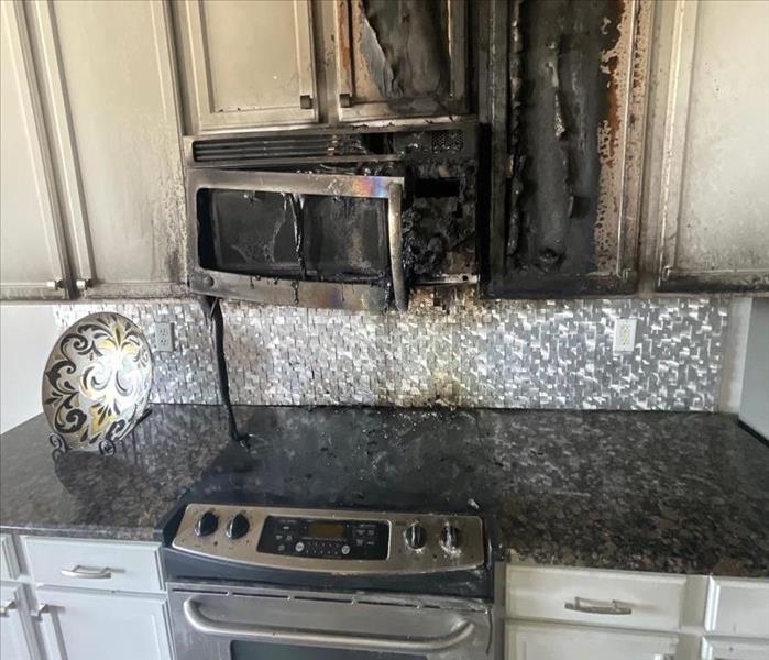 charred, fire damaged kitchen