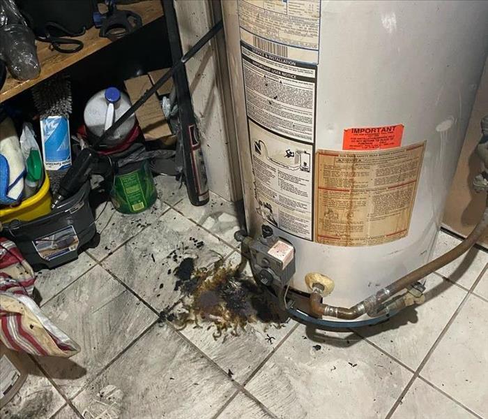 Fire and soot damage around a hot water heater. 