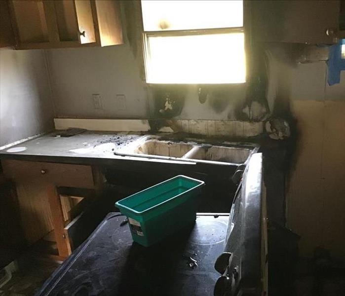 burned out kitchen, sink window