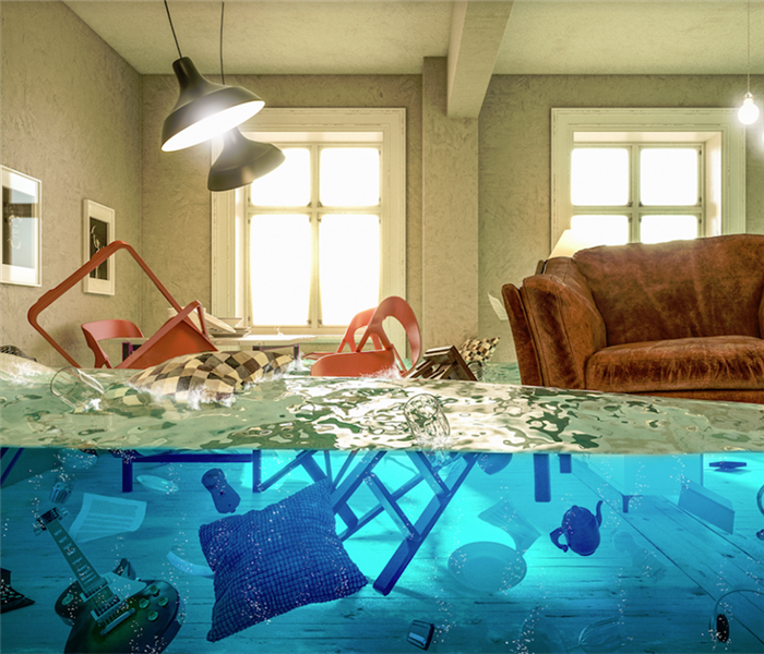 a flooded living room with items floating everywhere