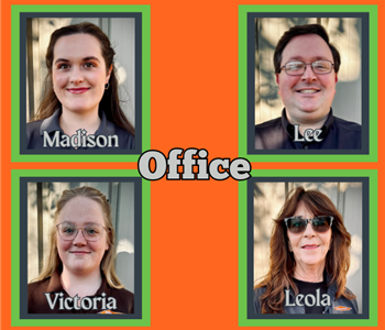 Four office team members in various SERVPRO attire standing in front of a white background